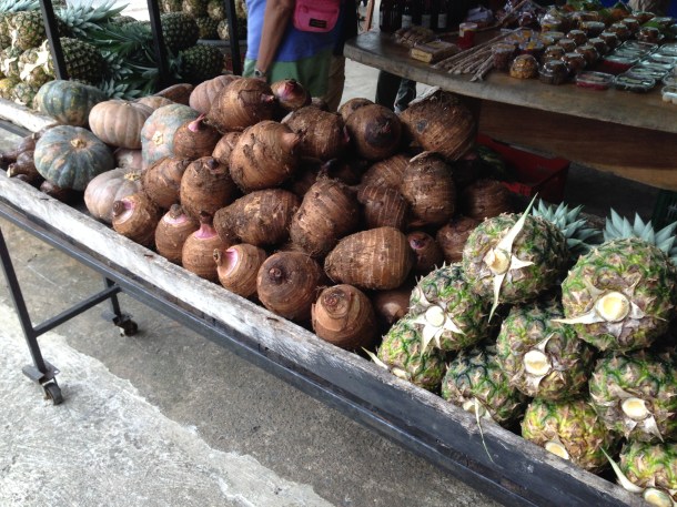 Left to right: pumpkins, purple sweet potatoes, and pineapples
